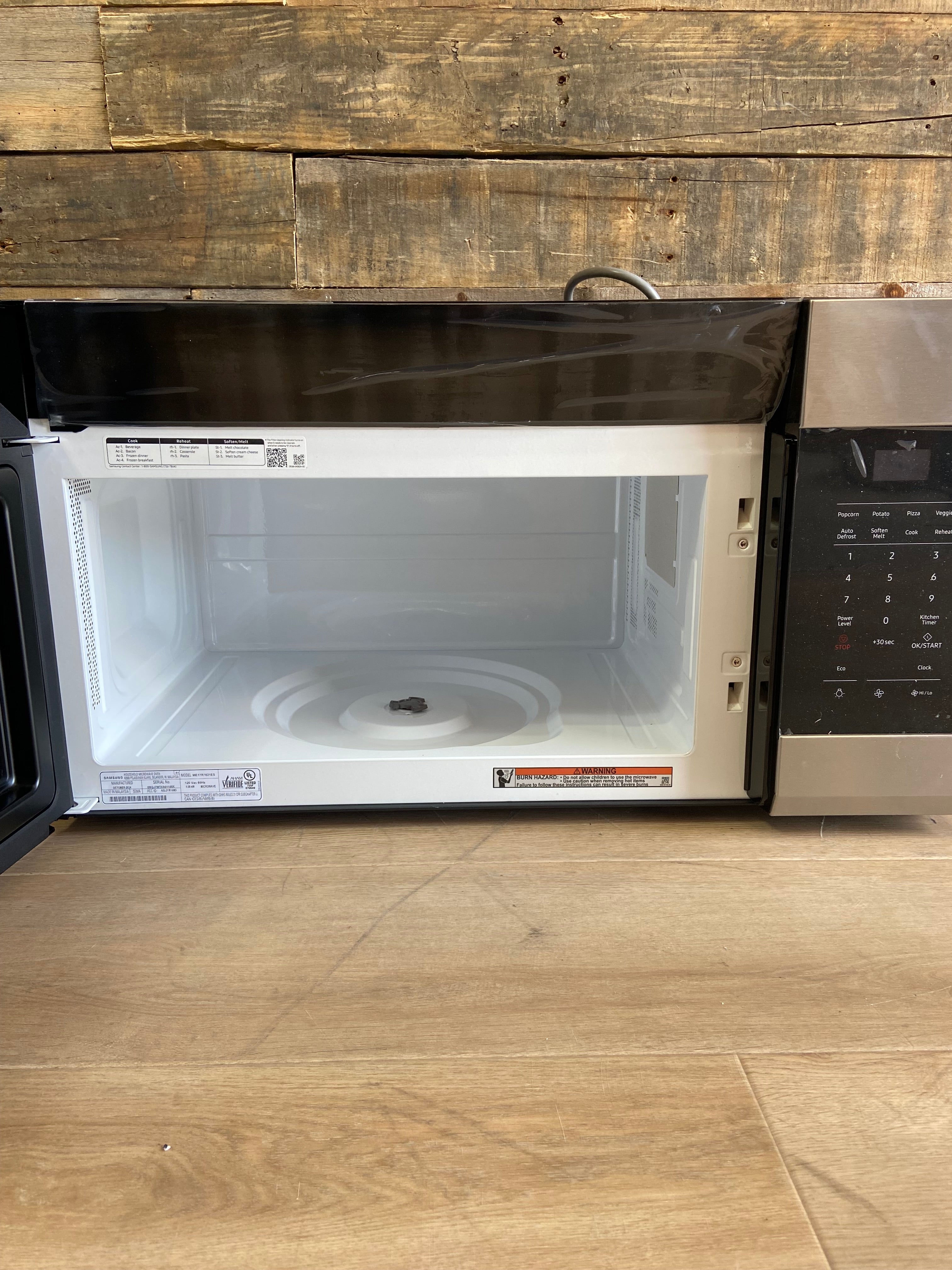 Stainless Samsung 1.6 cu. ft. 1000 W Over-the-Range Microwave with Auto Cook