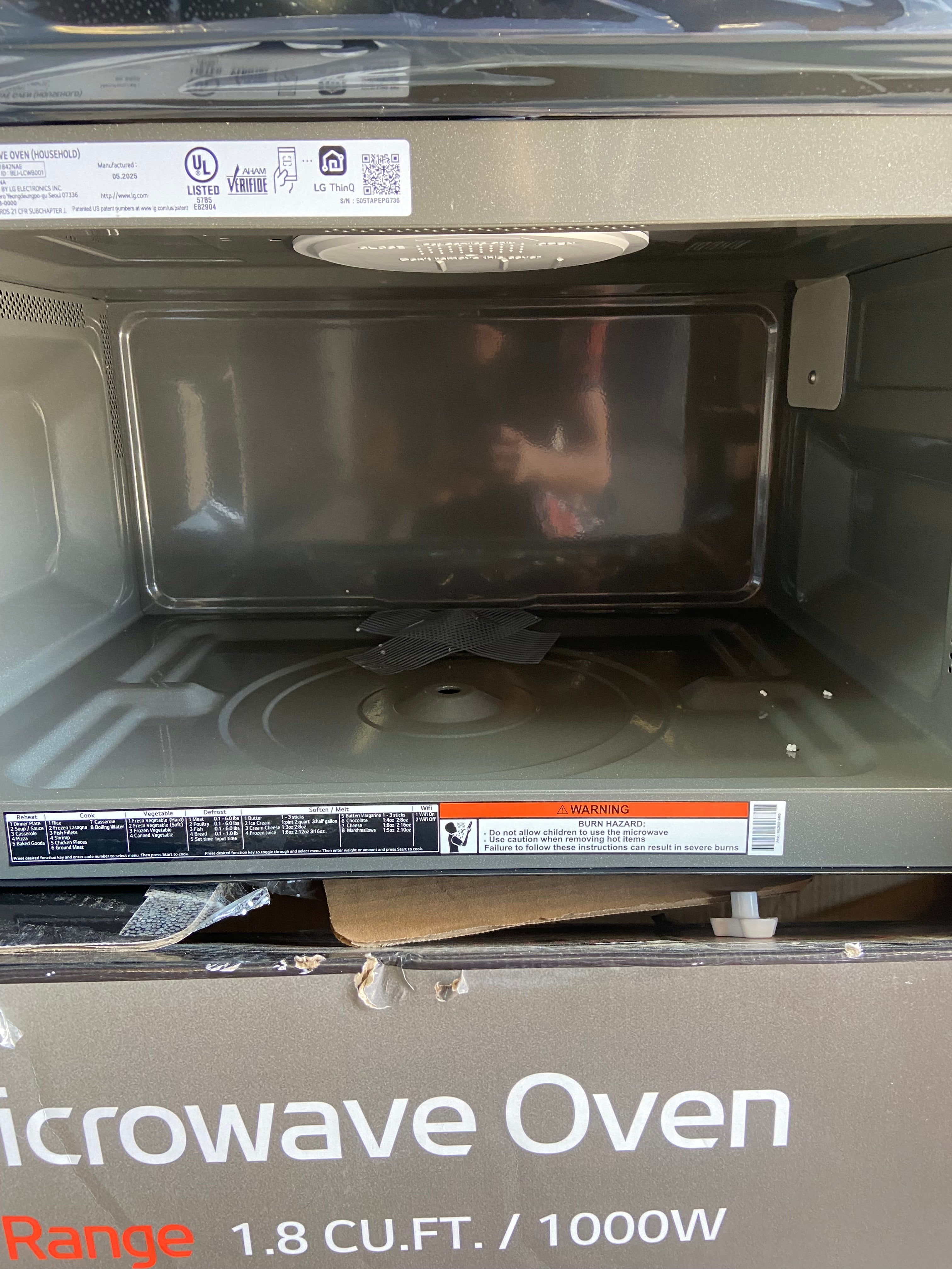 Black and Stainless 1.8 cu. ft. Smart Over-the-Range Microwave Oven with EasyClean®