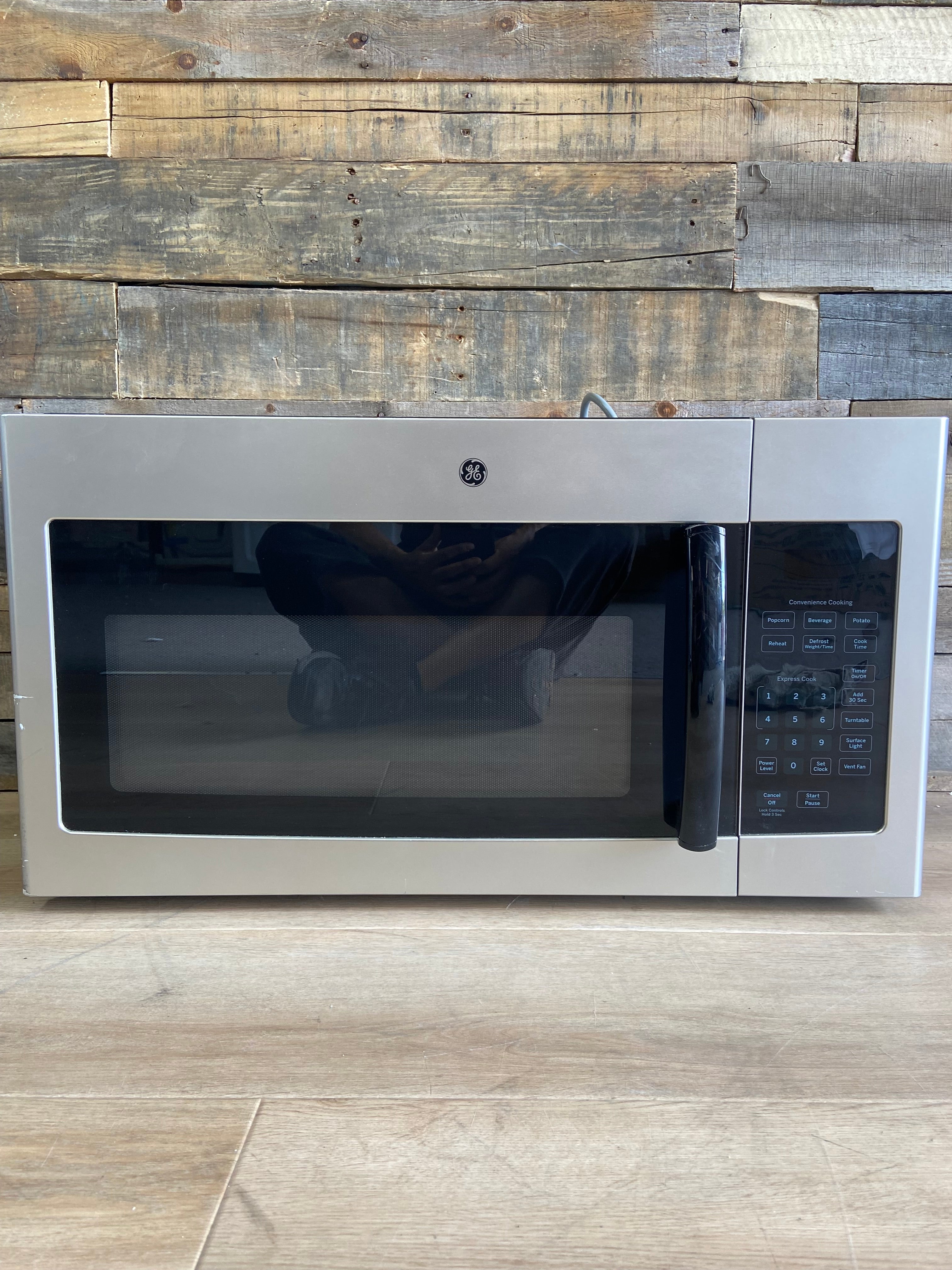 Stainless GE® 1.6 Cu. Ft. Over-the-Range Microwave Oven with Recirculating Venting