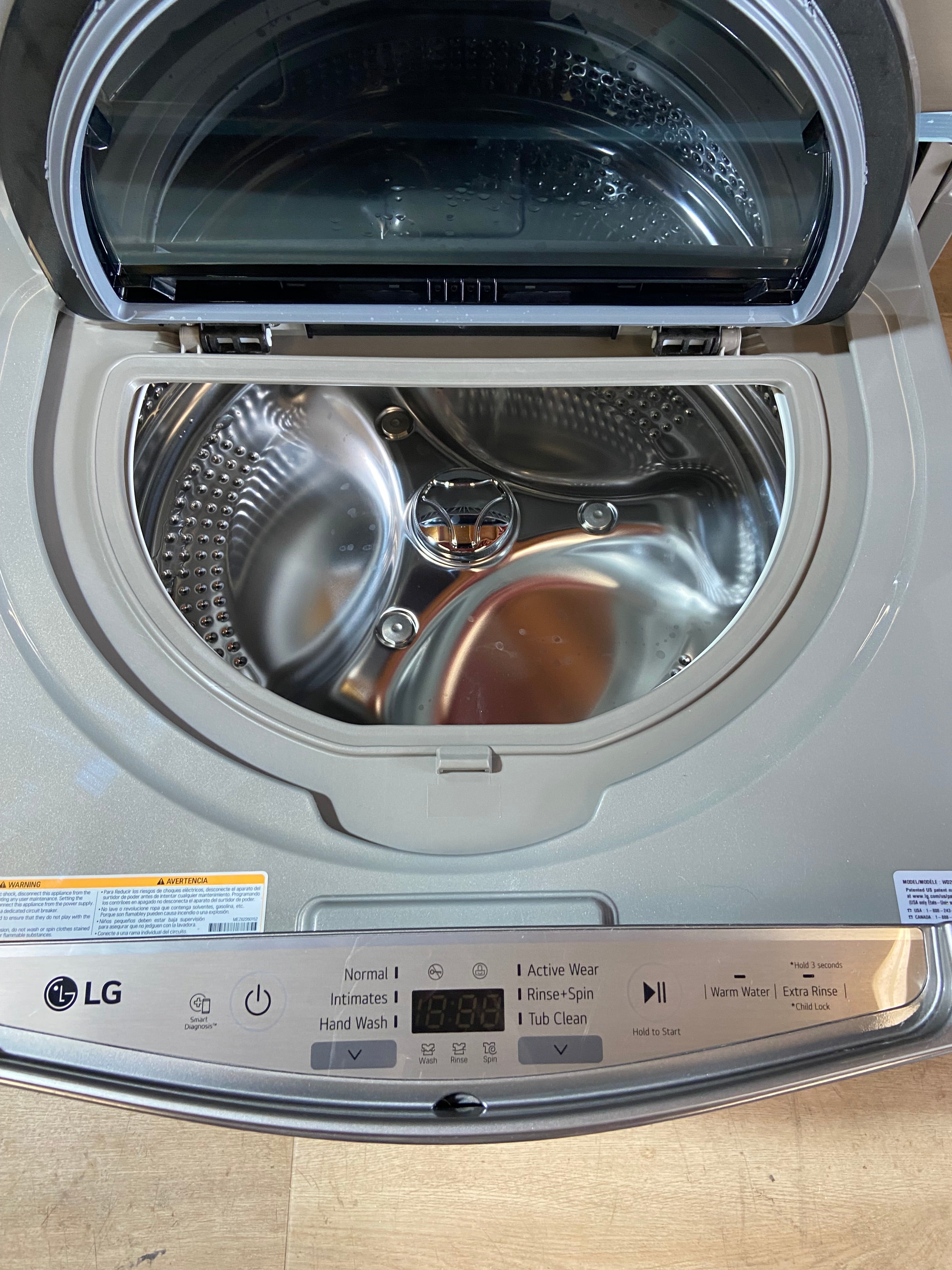 5.2 cu. ft. Mega Capacity Smart Wi-Fi Enabled Front Load Washer With LG 1.0 Cu. ft SideKick Pedestal Washer