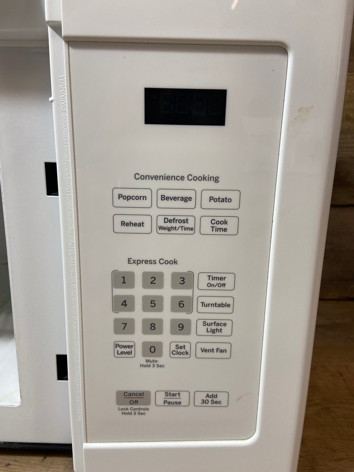 White GE Over The Range Microwave