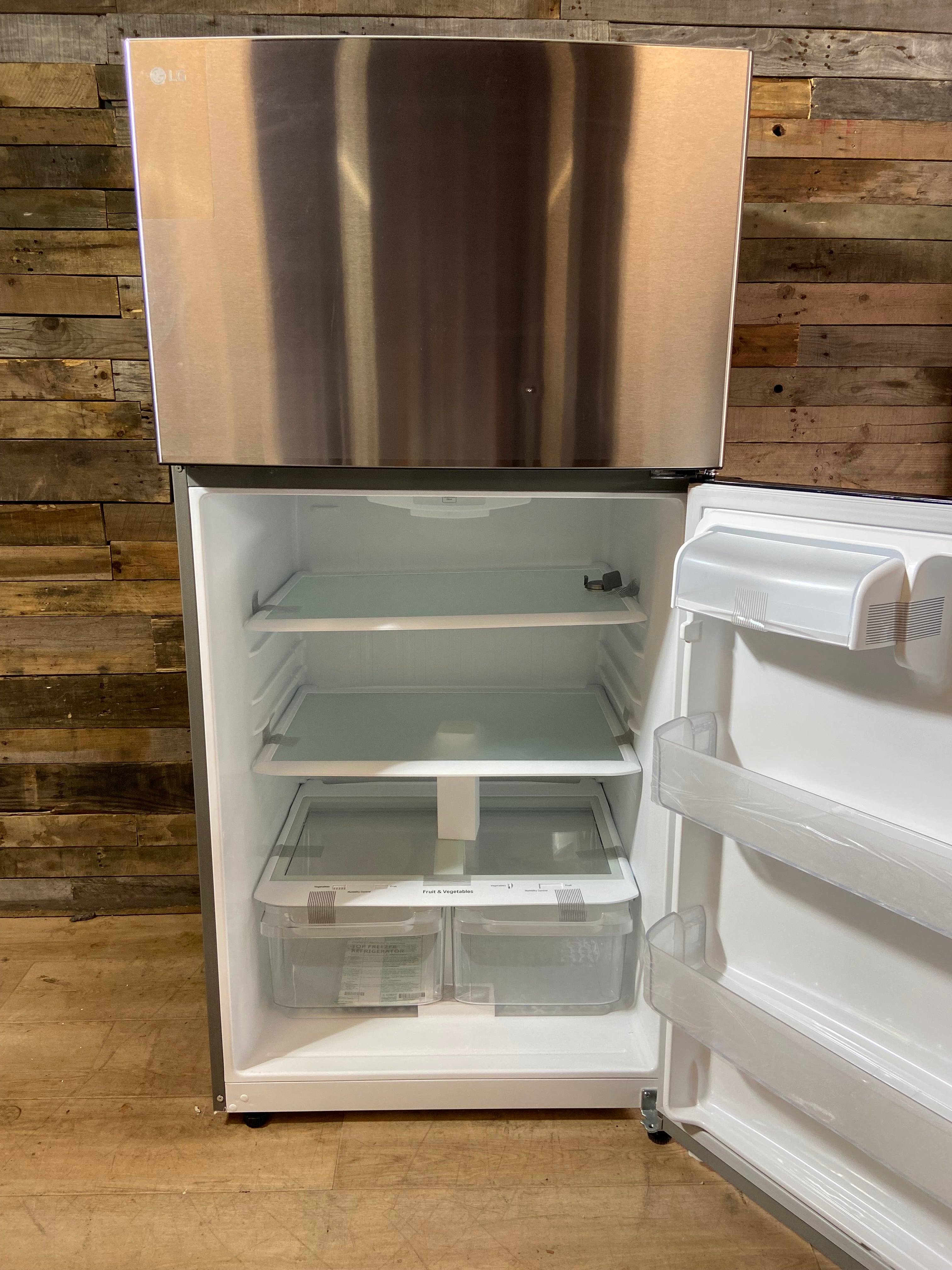 LG 33” 24 cu. Ft Stainless Steel Top Freezer Refrigerator
