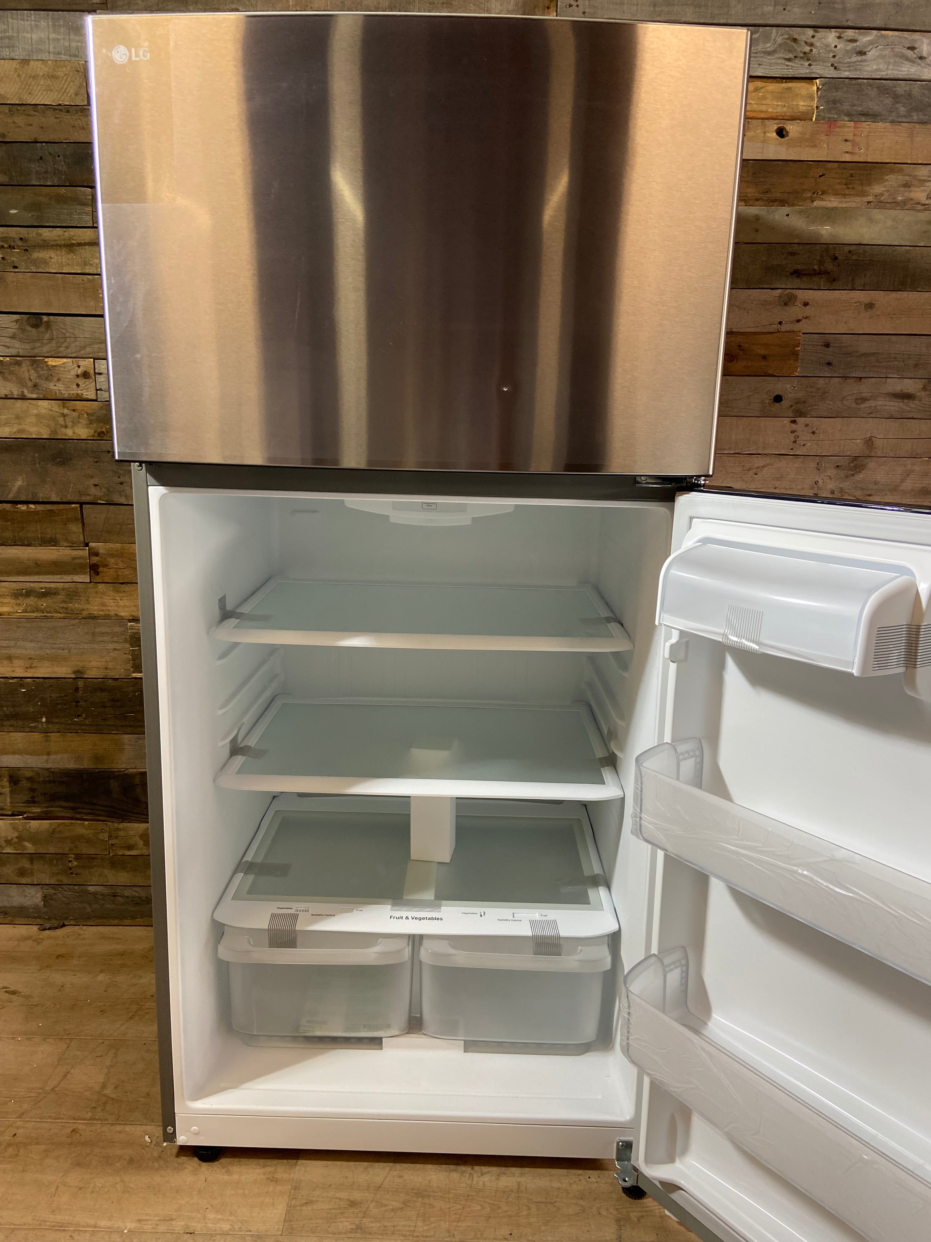 LG 33” 24 cu. Ft Stainless Steel Top Freezer Refrigerator