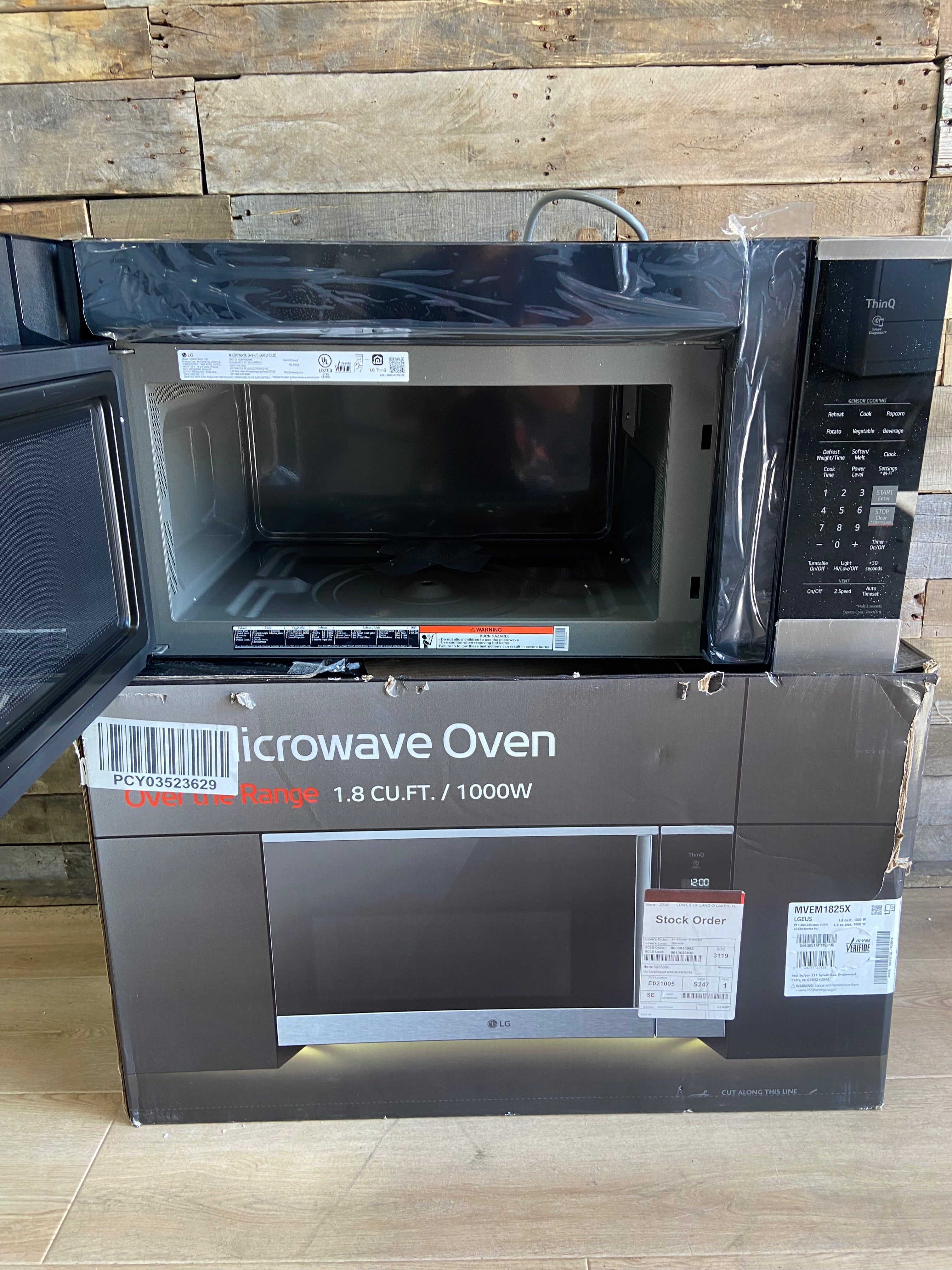 Black and Stainless 1.8 cu. ft. Smart Over-the-Range Microwave Oven with EasyClean®