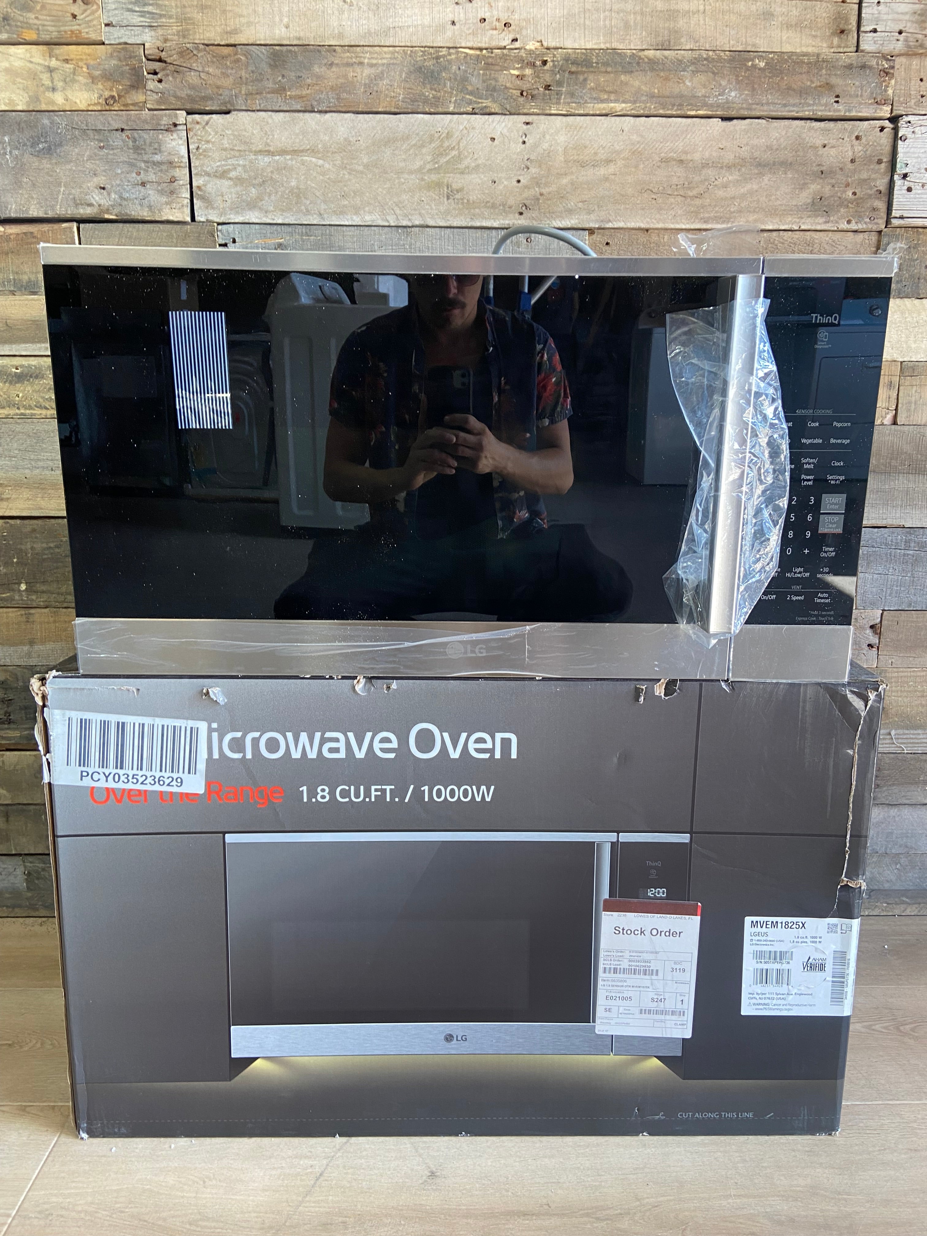 Black and Stainless 1.8 cu. ft. Smart Over-the-Range Microwave Oven with EasyClean®